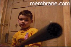 Still from the Crossfire Conspiracy/A
little boy with a big gun